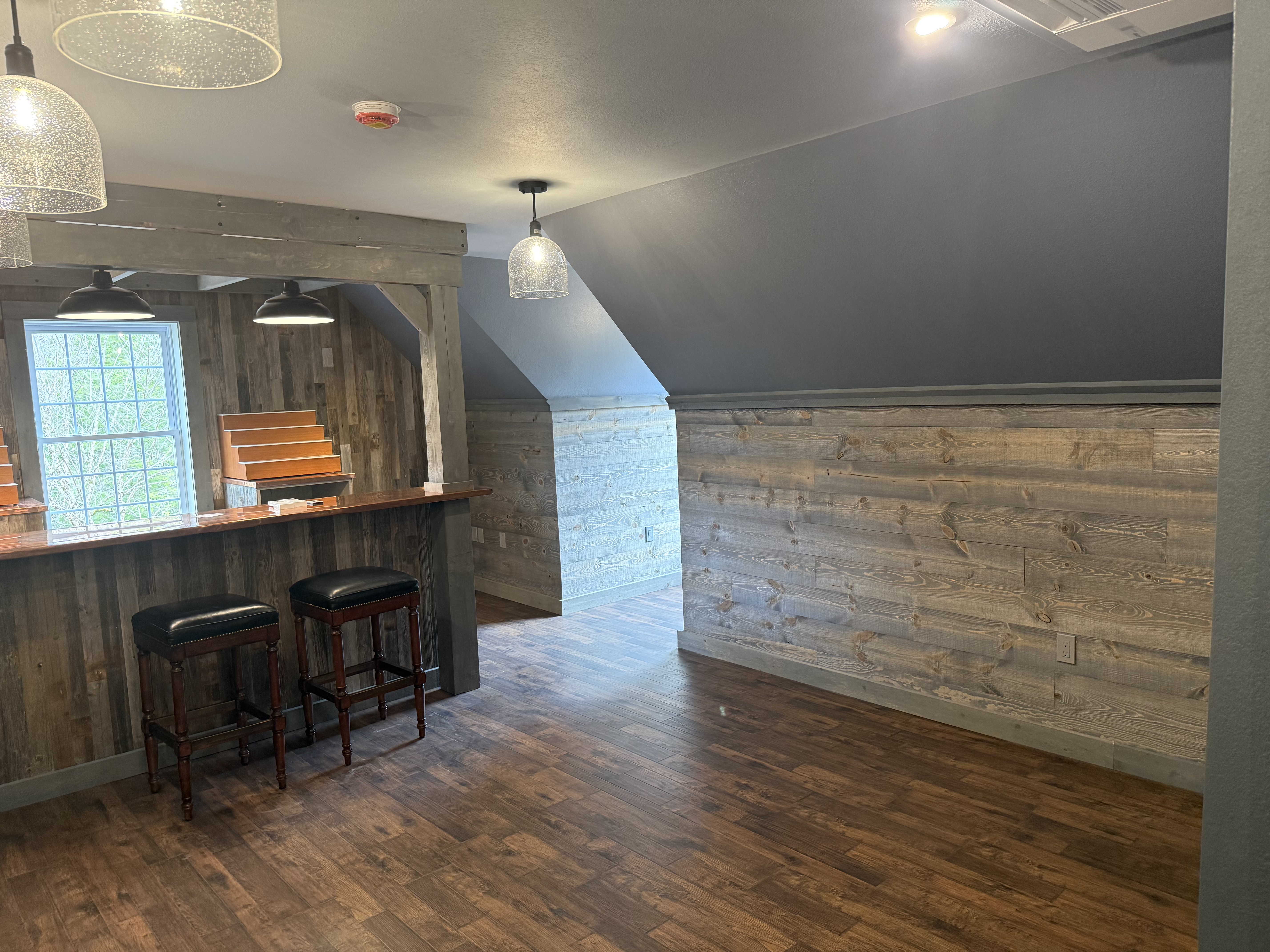 Finished basement with recessed lighting and luxury vinyl plank flooring