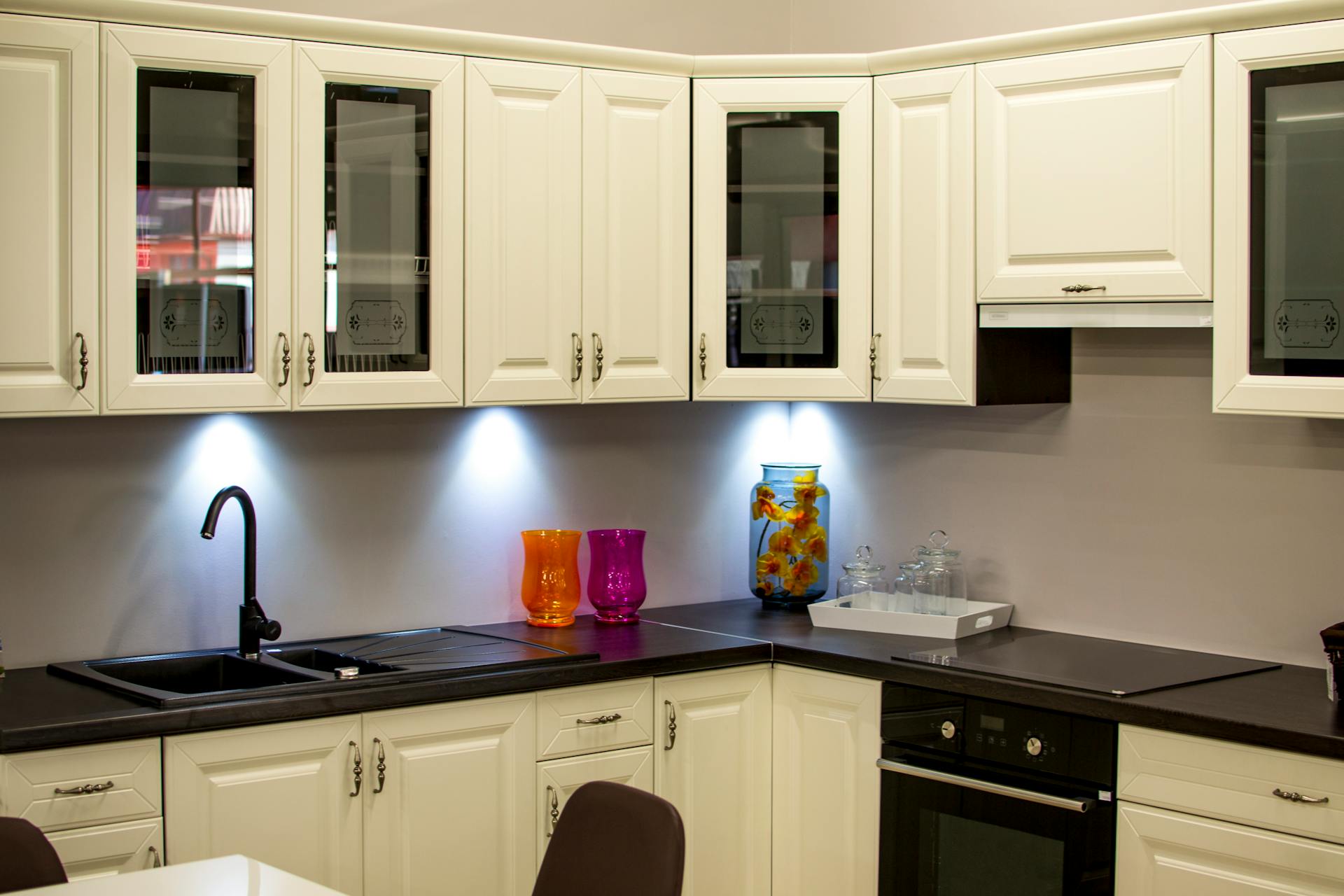 Bright open-concept kitchen with white shaker cabinets and quartz countertops